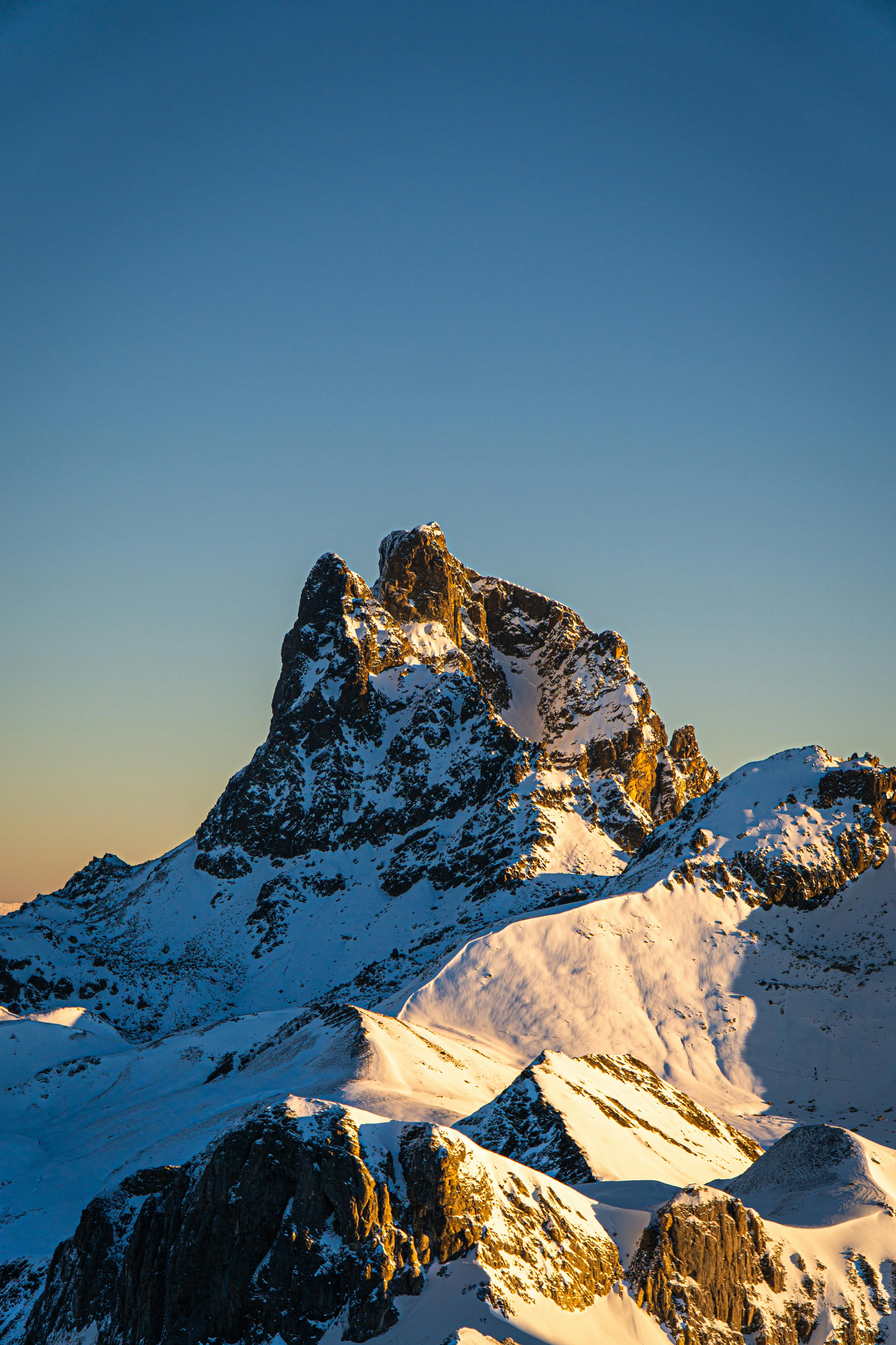 Prescription Goggle Inserts - Scenic view of the majestic snow-covered Pic du Midi d'Ossau during sunset in the Pyrenees, France.