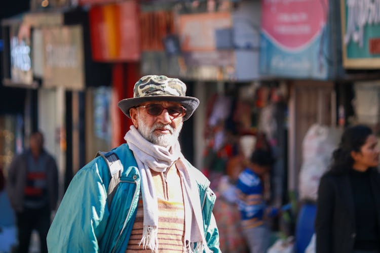 Elderly Man On A Street Market 