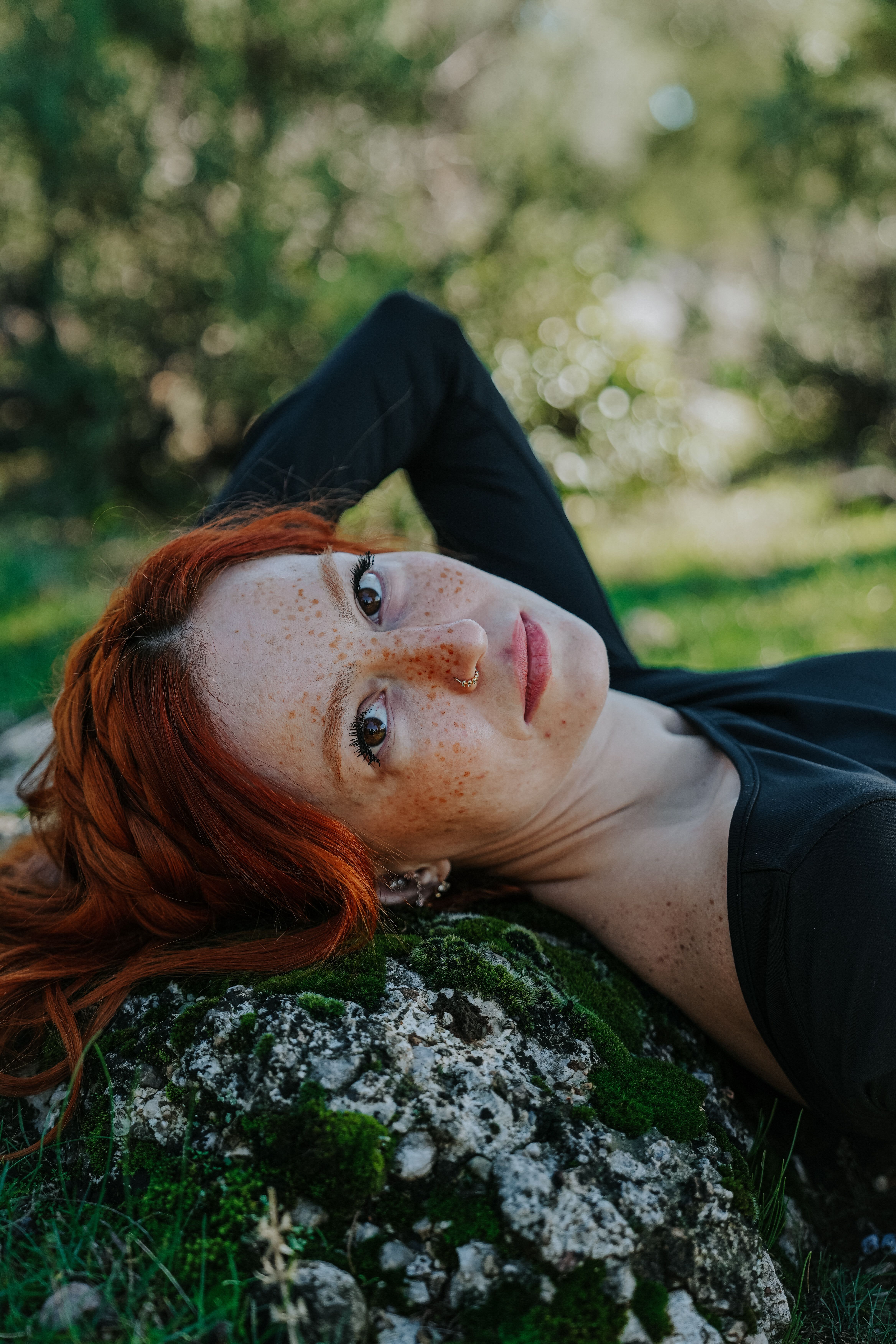 Young Redhead Lying on the Ground in a Park in Summer · Free Stock Photo