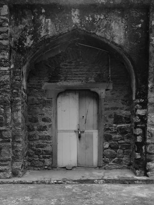 Black and White Photo of a Door 