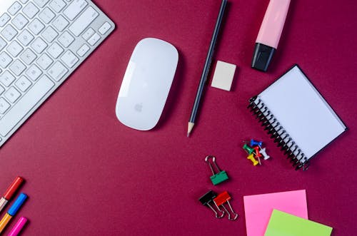 Free Keyboard and a Mouse with Stationary on a Desk  Stock Photo