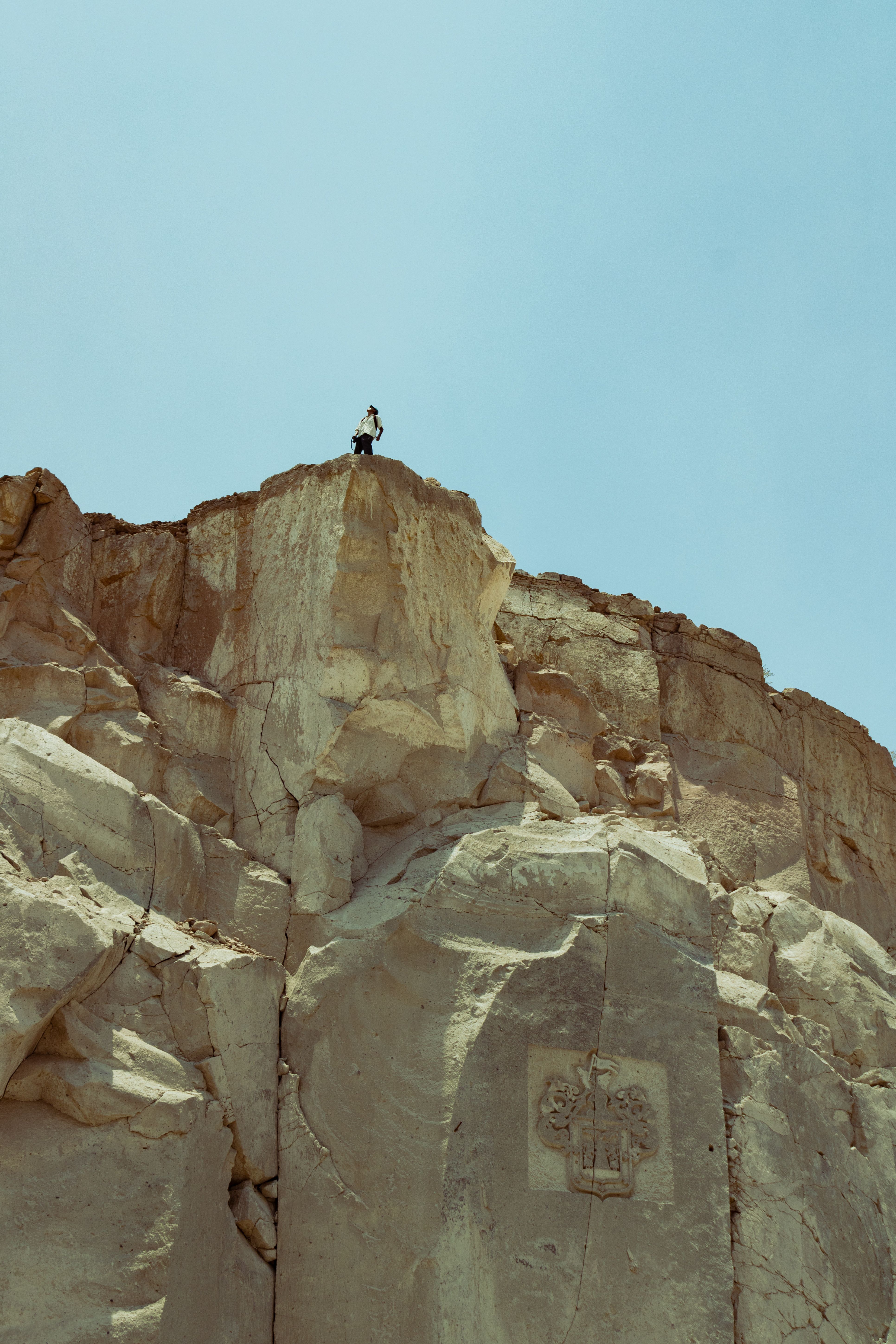 A person standing on top of a rock · Free Stock Photo