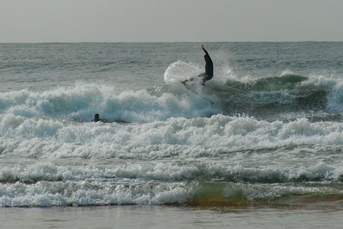 Man Surfing on the Sea 