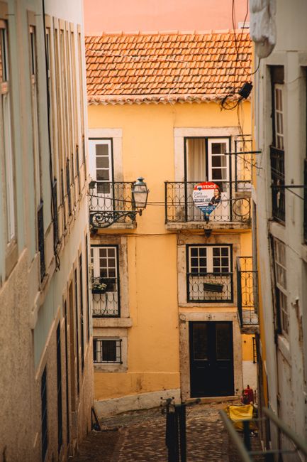 Explore the narrow, charming streets of Lisbon with classic architecture and colorful facades.