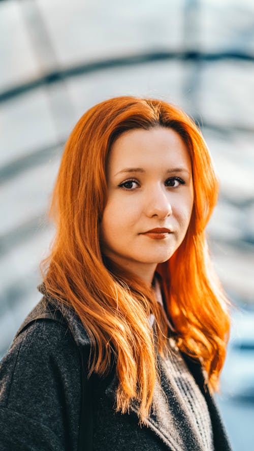 Portrait of a Young Redhead in a Coat