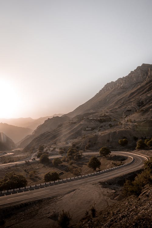 View of a Road in Mountains at Sunset 