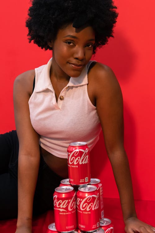 Woman With Soda Cans