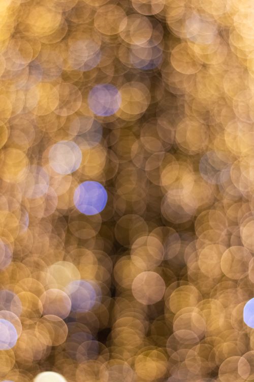 Free Vibrant golden and blue bokeh lights create a festive abstract background. Stock Photo