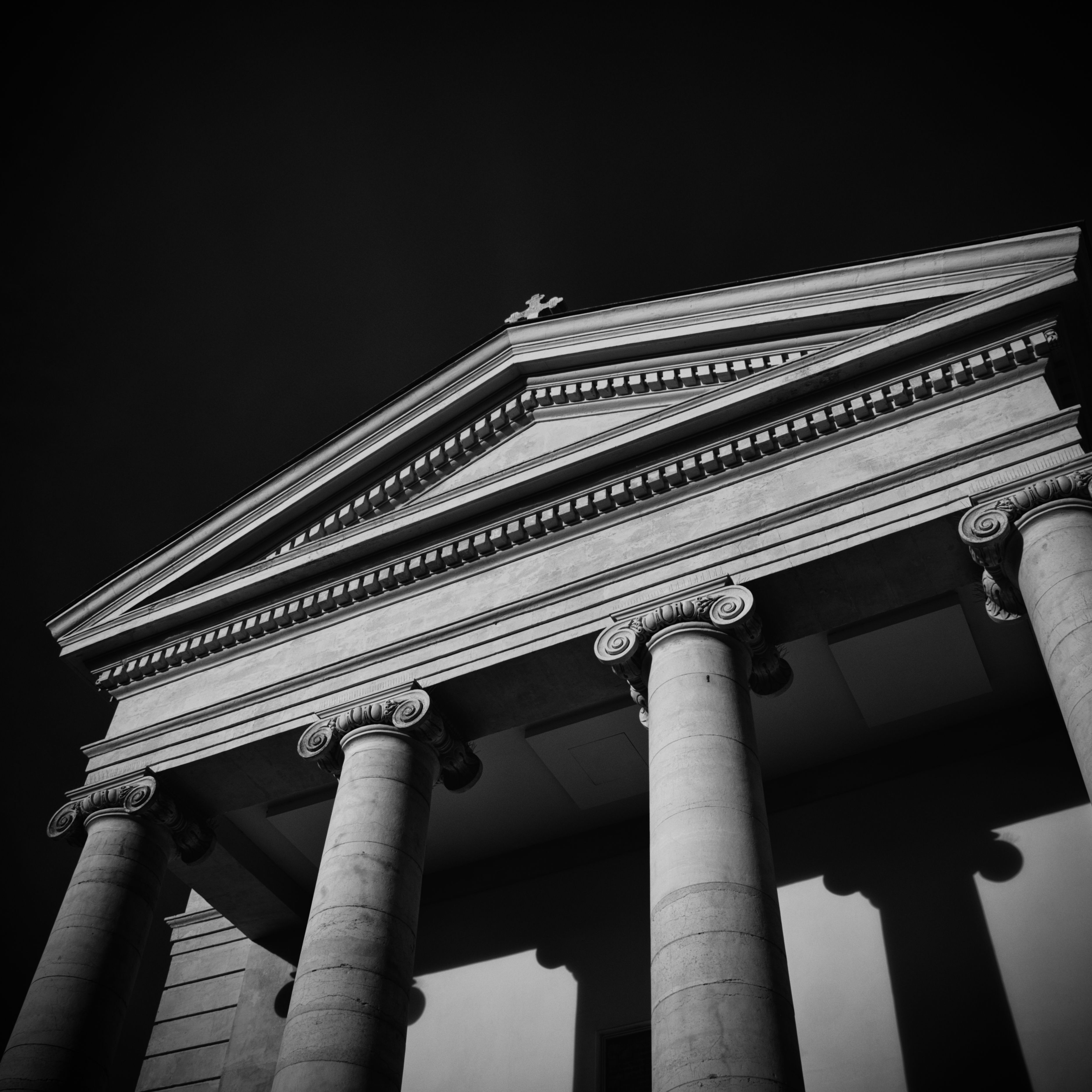 Classical columns on a courthouse facade — photo by Jean-Philippe Canto on Pexels