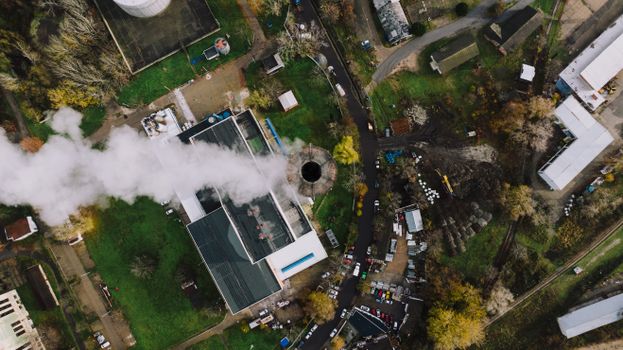Aerial shot of a factory in Beograd, Serbia, with visible smoke from the chimney.