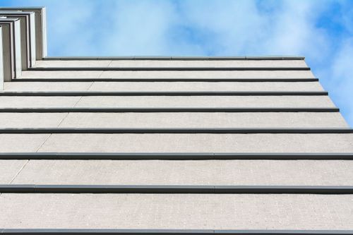 Free A minimalist view of a building facade against a clear blue sky. Stock Photo