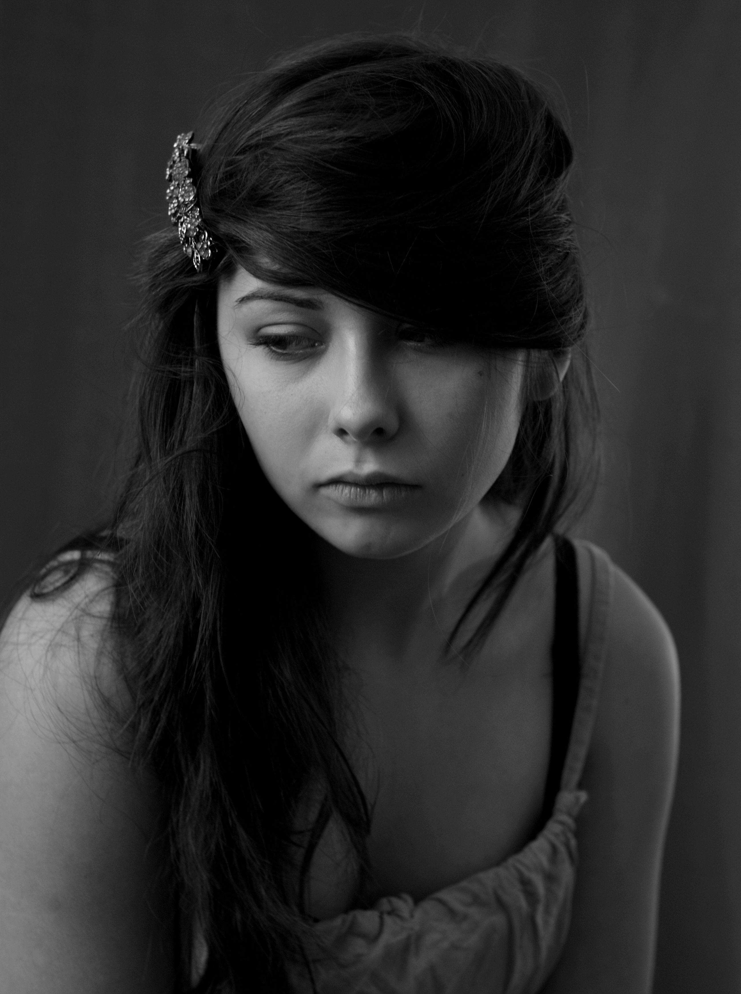 A black and white photo of a woman with a flower in her hair · Free ...