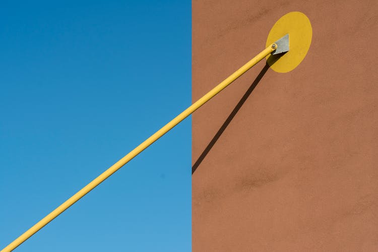 Close-up Of A Metal Pipe Attached To A Building Exterior 