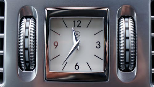 Grey Mercedes-benz Vehicle Clock at 11:36 O'clock