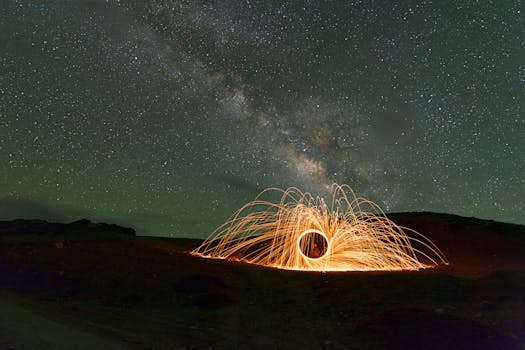 A mesmerizing night sky over Kaza, HP, India, with a dazzling fireworks display illuminating the landscape.
