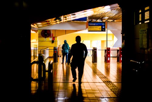Free A silhouette of people at a subway entrance in Jakarta, Indonesia. Stock Photo