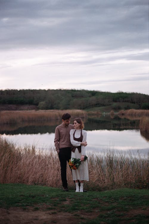 Man and Woman near Pond Together