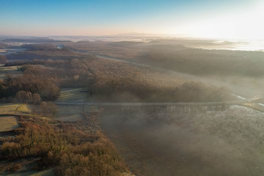 Serene aerial landscape of a foggy autumn morning in the countryside near Garešnica, Croatia.