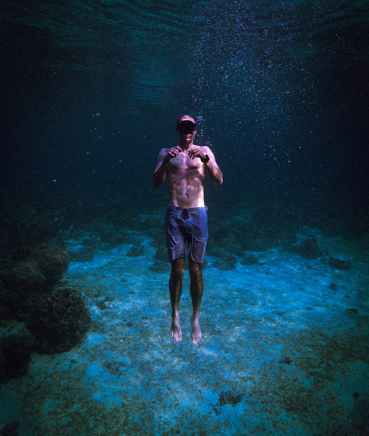 Man Diving In Ocean