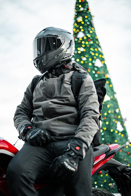 Man in a Helmet Sitting on a Motorcycle