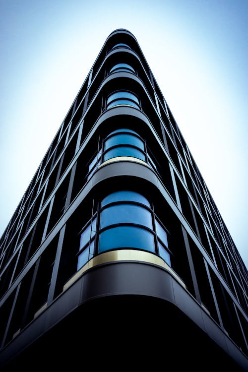 Modern Futuristic Building against Blue Sky