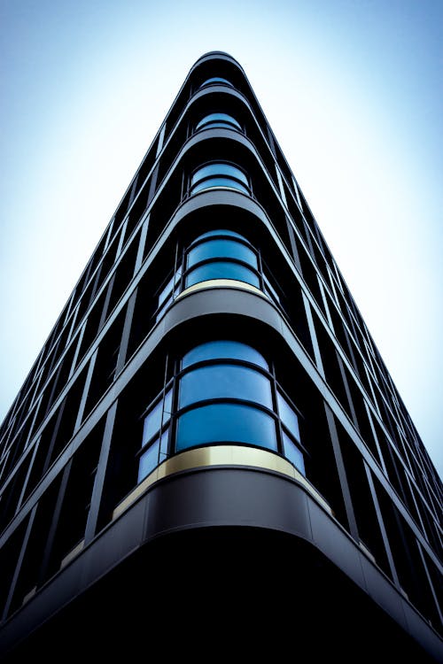 Free Modern Futuristic Building against Blue Sky Stock Photo