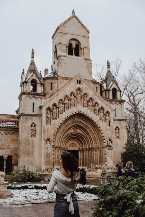 Woman Standing in front of Jaki Chapel in Budapest, Hungary 