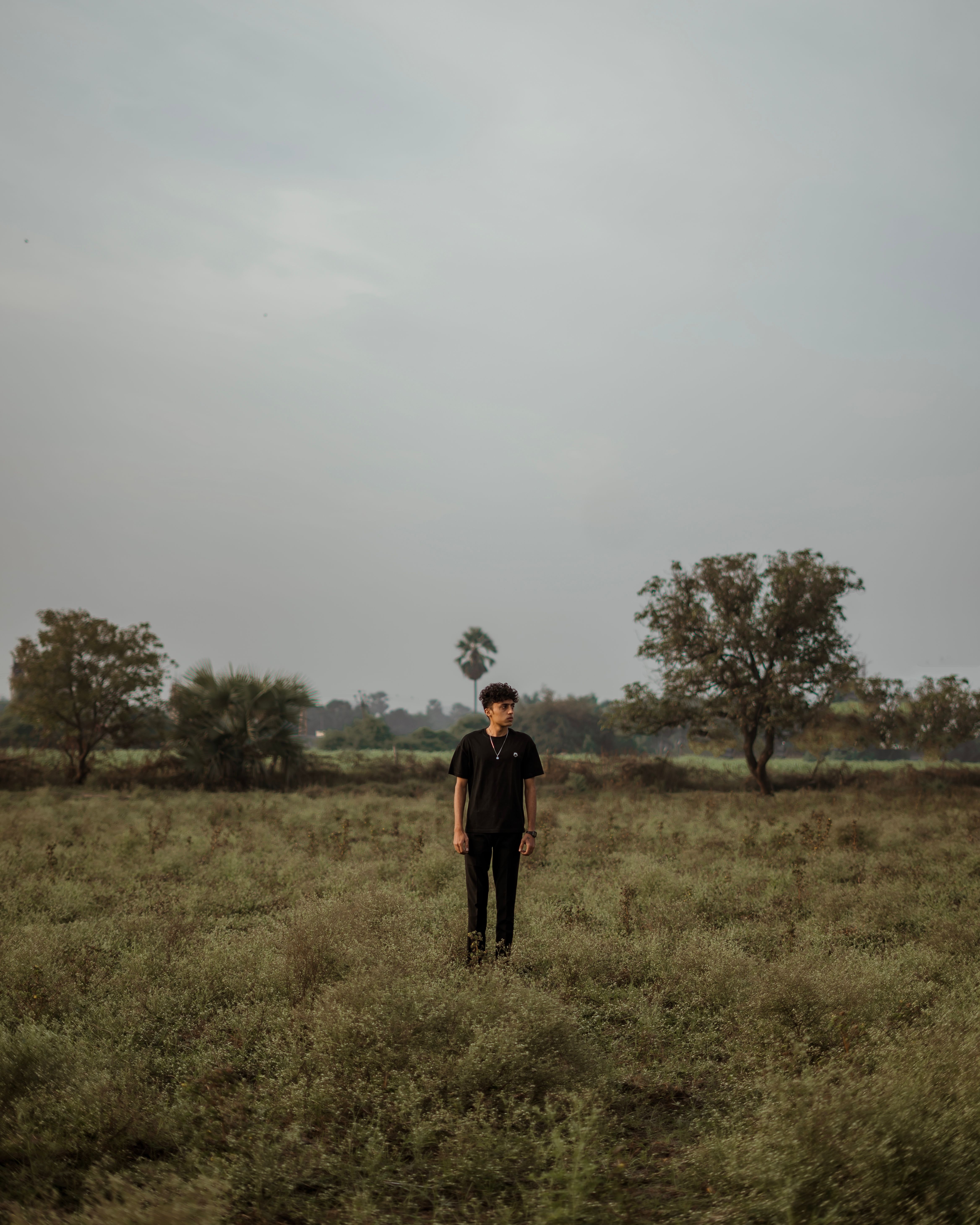 Man Standing on Grassland · Free Stock Photo