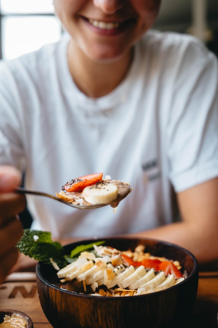 Smiling Person Eating Breakfast