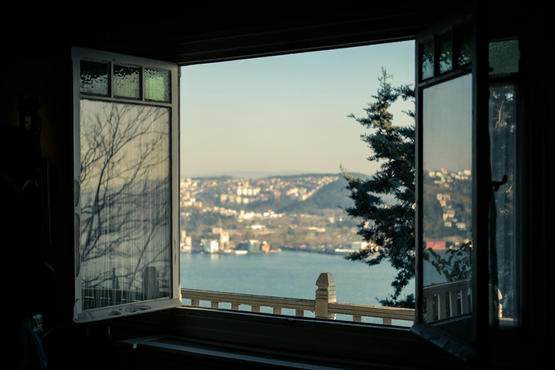 View of a Body of Water and City from a Window on a High Floor