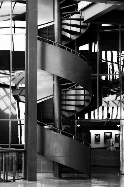 Black and White Photo of a Modern Spiral Staircase 