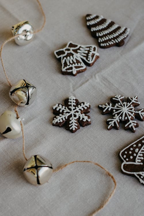 String of Christmas Bells and Gingerbread Cookies Decorated with Icing