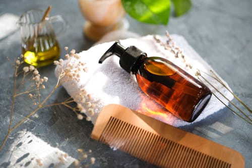 Comb and Bottle of Cosmetic