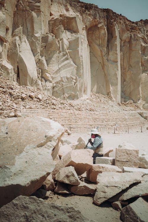 Rocks and a Man Working in a Quarry