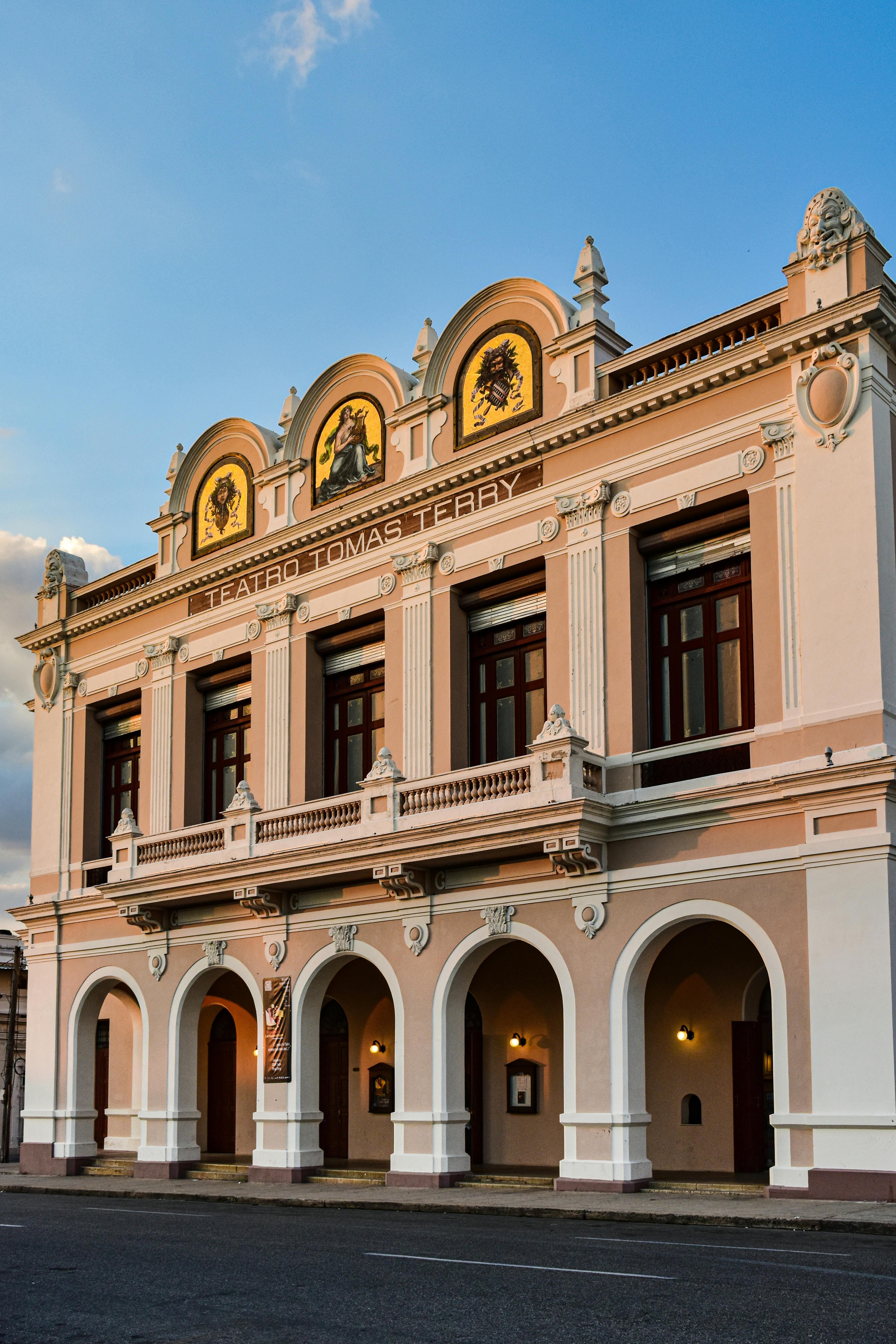 Free Elegant facade of Teatro Tomas Terry, Cienfuegos, Cuba, under the warm glow of sunset. Stock Photo