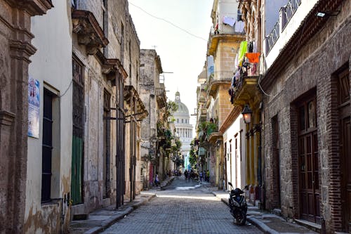 View of the National Capitol of Cuba from a Narrow Alley between Apartment Buildings 