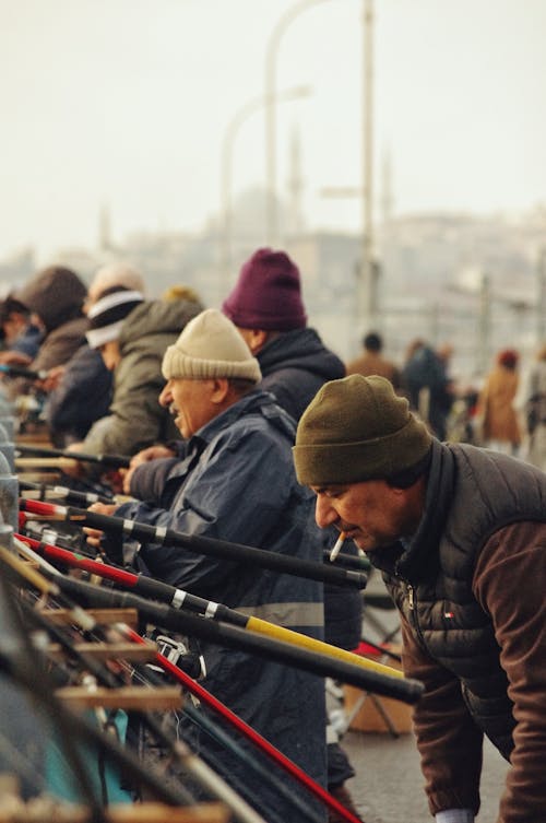 Men with Fishing Rods Standing on the Bridge 