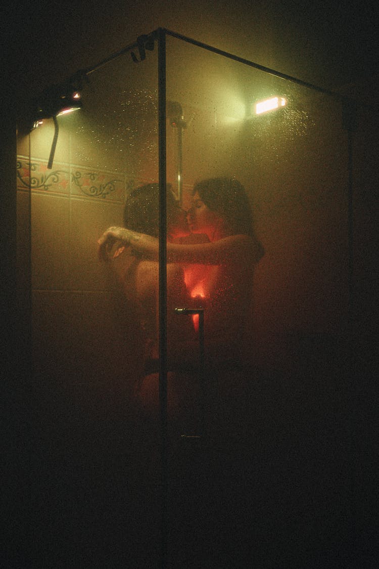 Couple Hugging And Embracing In Shower