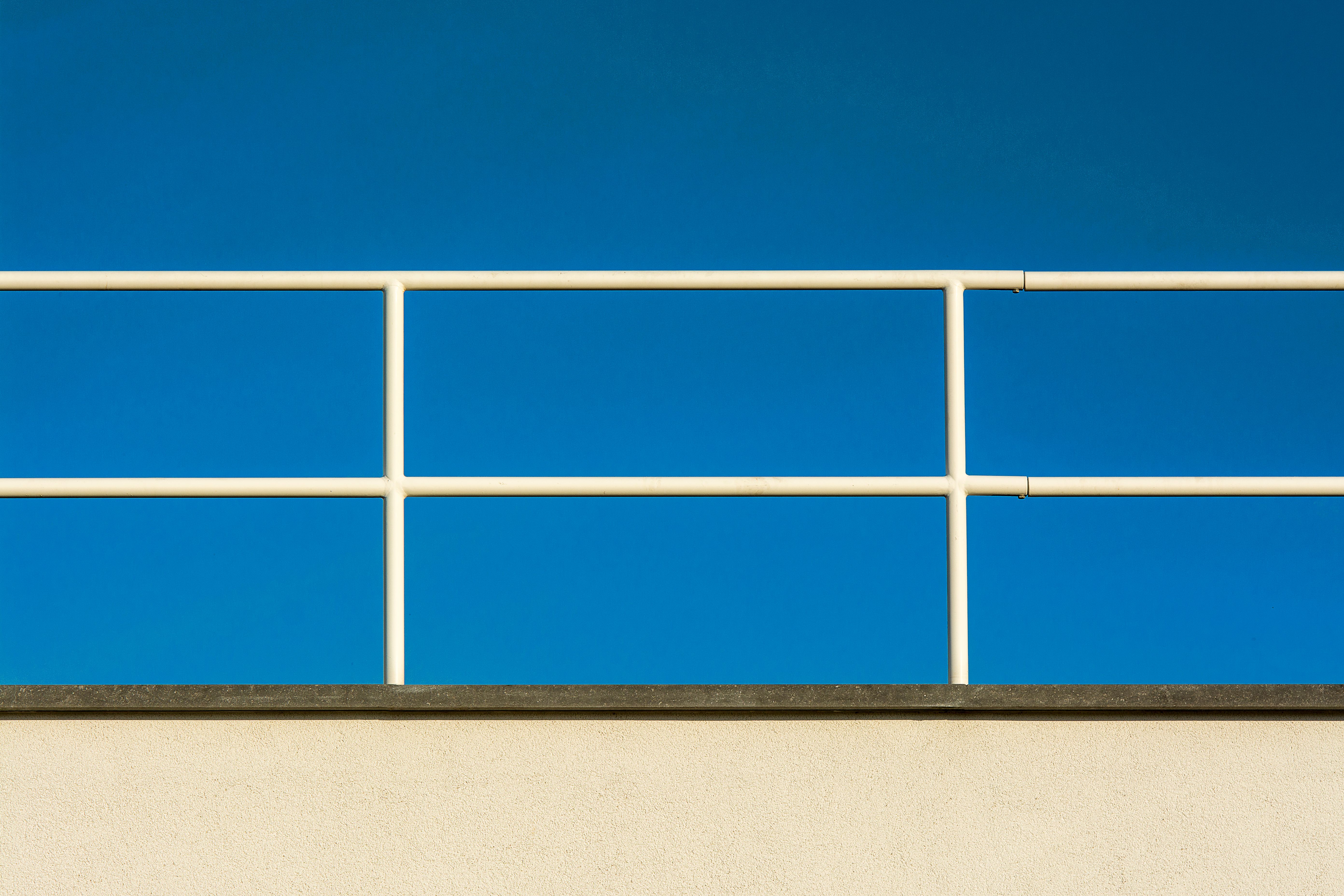 Railings Against Blue Sky · Free Stock Photo