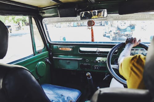 View from the Interior of a Man Driving a Truck 