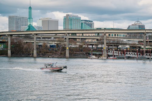 A Boat on a River with the View of the City of Portland, Oregon