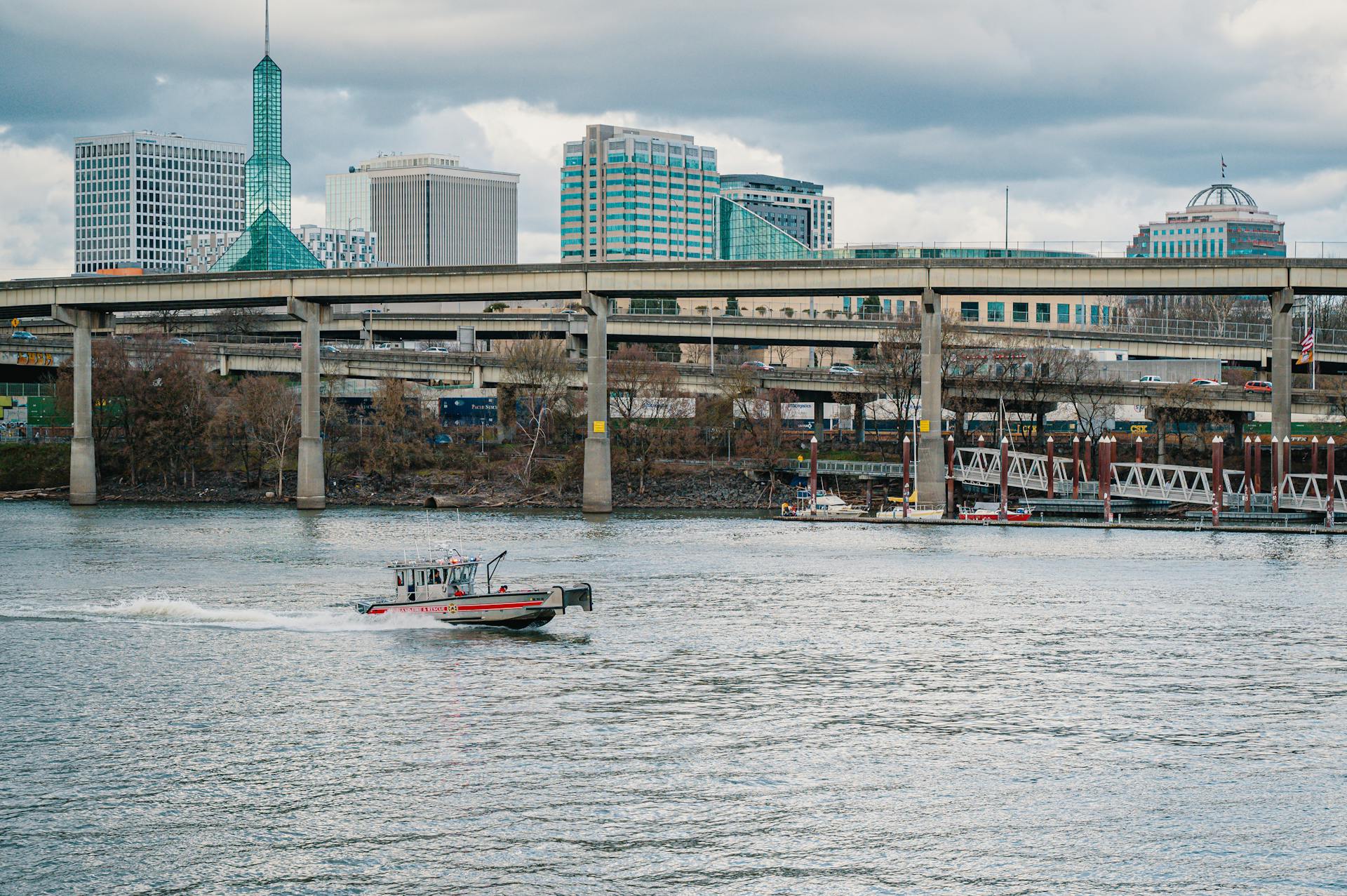 A Boat on a River with the View of the City of Portland, Oregon