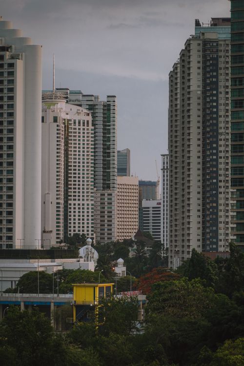 Free A view of Jakarta's urban skyline featuring skyscrapers and lush greenery. Stock Photo