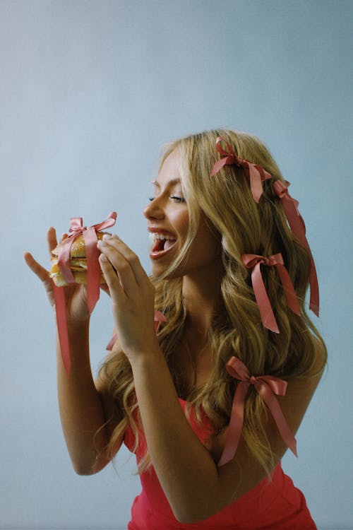 Woman With Burger Tied Up with Ribbon