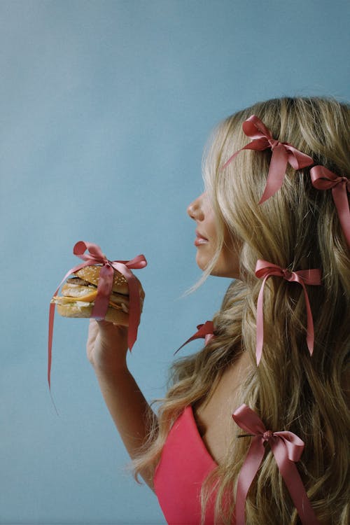 Woman With Burger Tied Up with Ribbon