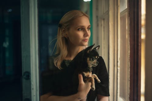 Young Woman Holding a Chihuahua 
