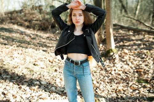 Brunette Young Woman in Leather Jacket and Jeans