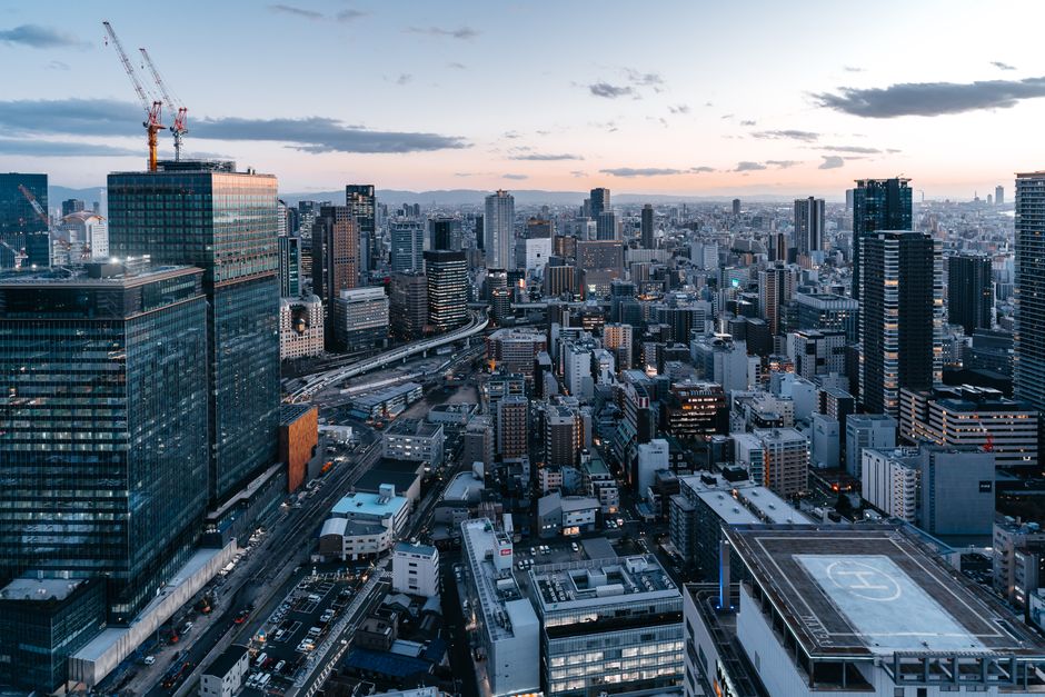 Stunning aerial view showcasing Osaka's modern cityscape and skyline at dusk.