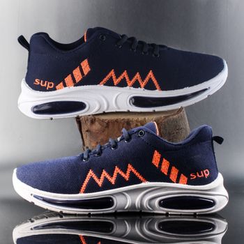Navy blue sports shoes with orange accents and unique zigzag design, captured in a studio setting.（イメージ）