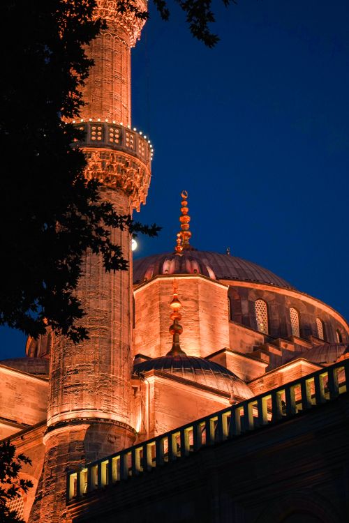 Free The Blue Mosque beautifully illuminated at night, showcasing its stunning architecture in Istanbul. Stock Photo